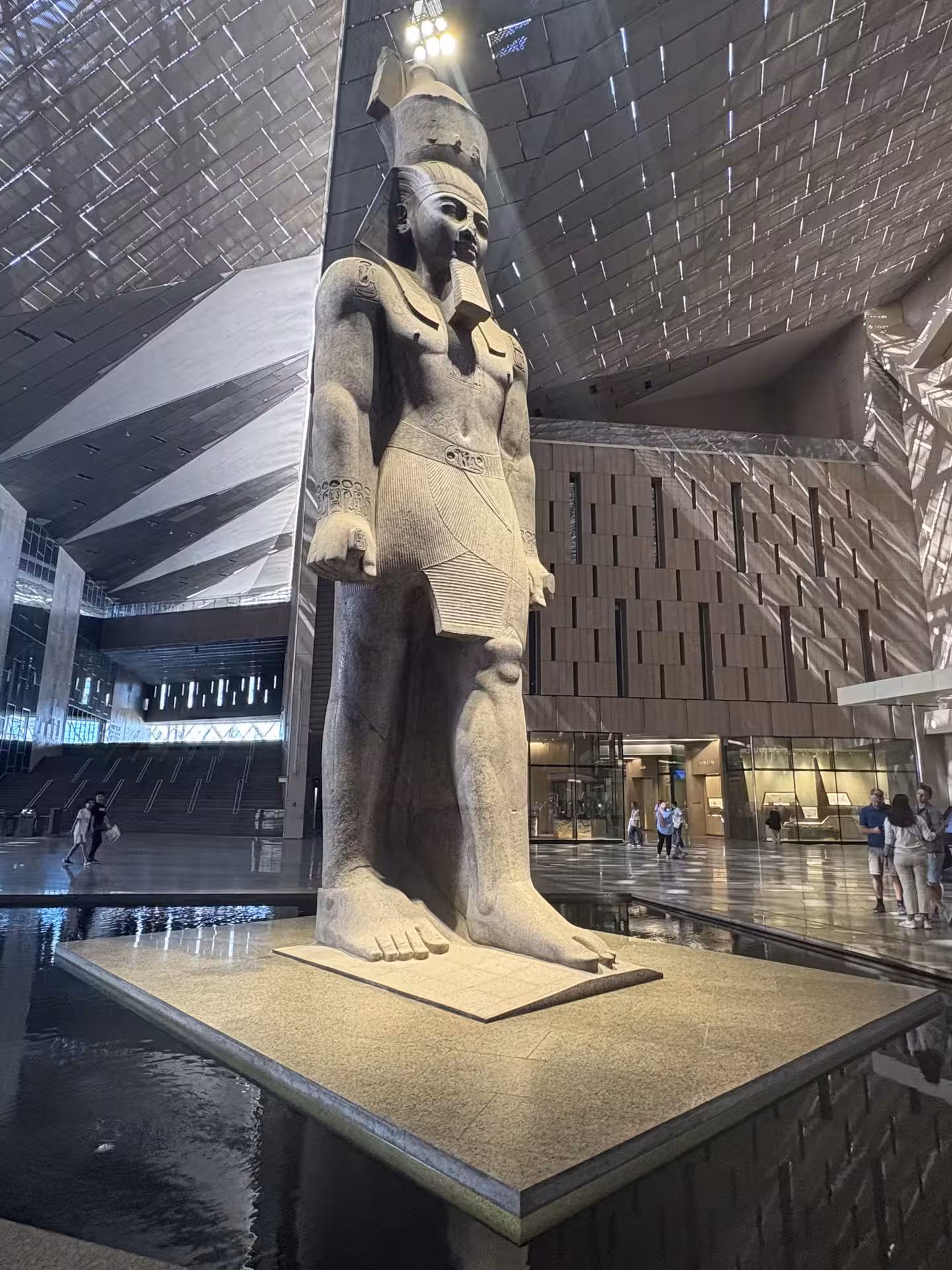 Colossal pharaoh statue in the Grand Egyptian Museum atrium, Cairo, on private all-inclusive tour