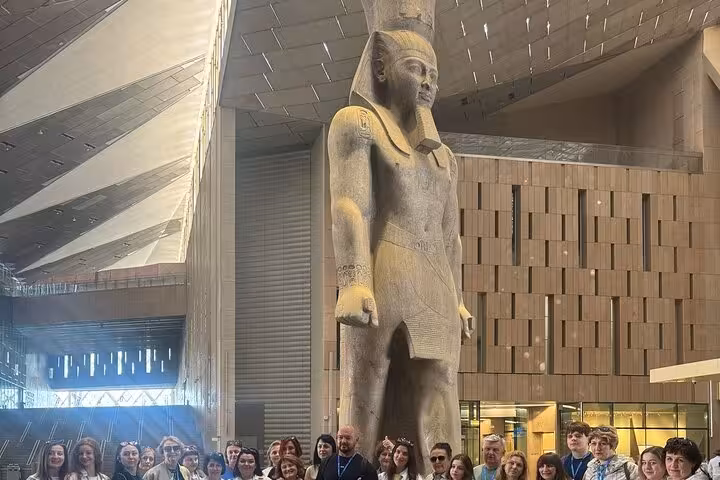 Colossal pharaoh statue inside the Grand Egyptian Museum Cairo on a private Giza pyramids tour