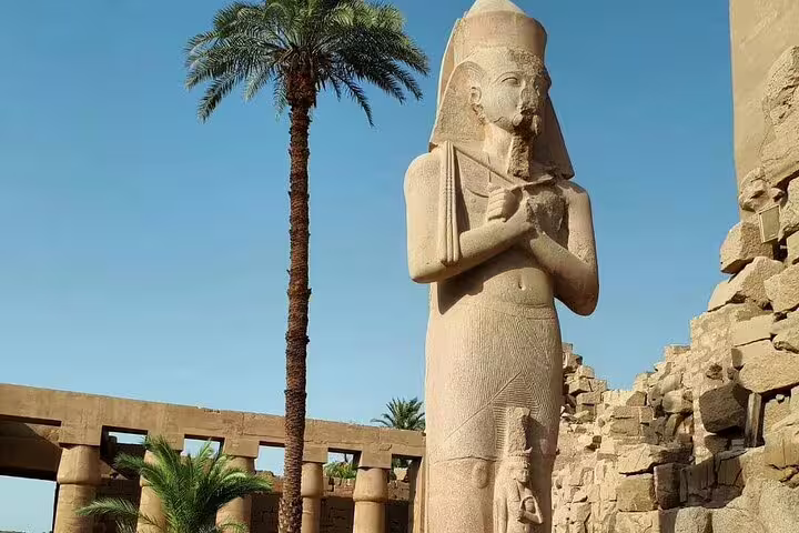 Pharaoh statue at Karnak Temple, Luxor sightseeing on 3 nights 2 days tour from Cairo by sleeper train