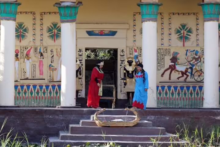 Costumed performers reenact ancient Egypt life at Pharaonic Village Cairo during a private tour experience