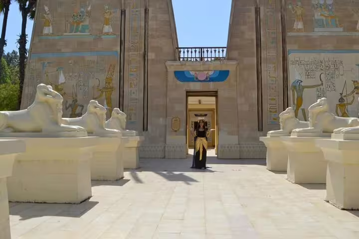 Temple-style gateway at Pharaonic Village Cairo with sphinx statues, ideal for a private guided tour