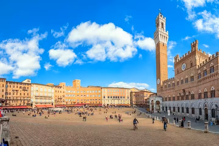 Vibrant Piazza del Campo in Siena with historic architecture and clear skies, a must-see on Chianti wine tours.