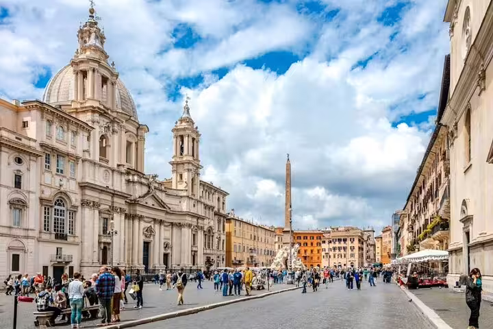 Crowds in Piazza Navona Rome strolling by Baroque churches and cafés on a Love Affairs and Papal Power walking tour
