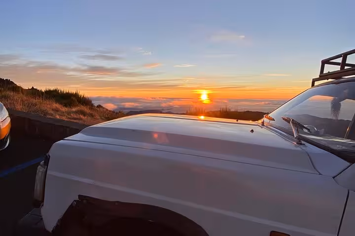 Sunrise from Pico do Areeiro beside 4x4 jeep on Madeira East coast expedition to Ponta São Lourenço