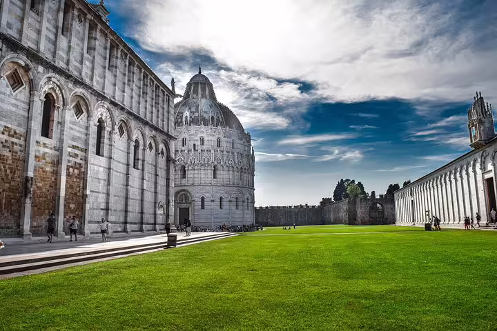 Pisa Cathedral and green lawn in Piazza dei Miracoli, key stop on the self-guided e-Scavenger Hunt Pisa tour