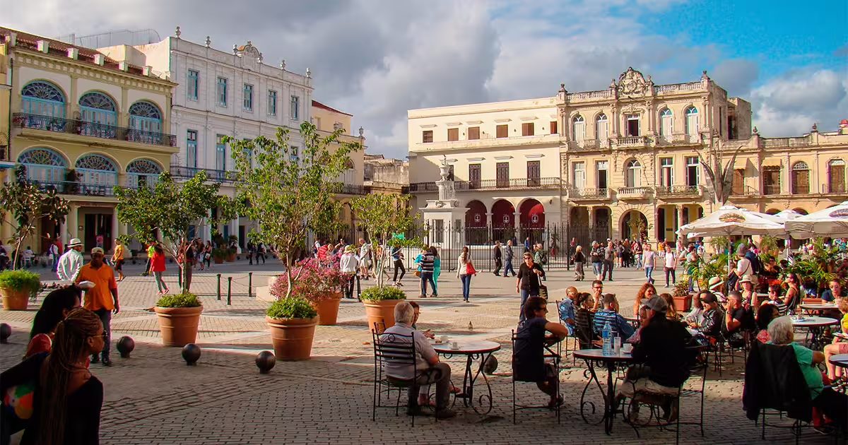 Lively Plaza Vieja Havana with outdoor café seating and historic buildings on a 3-hour private guided city tour