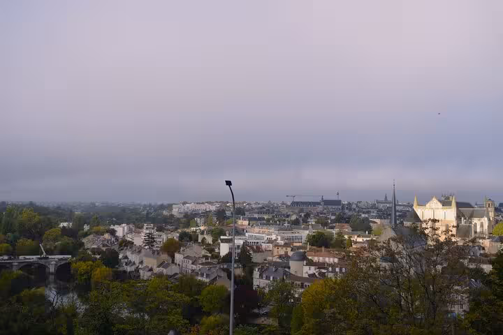 Panoramic view of Poitiers cityscape with historic architecture and lush greenery, ideal for a cultural walking tour.