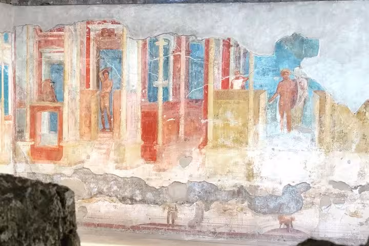 Colorful fresco depicting everyday life, preserved on the walls of ancient Pompeii, showcasing Roman artistry.