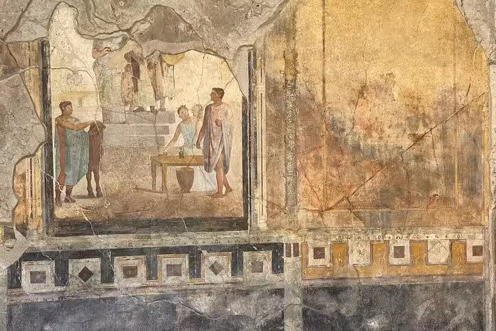 Discover preserved Pompeii frescoes depicting daily Roman scenes on a Positano to Pompeii tour.