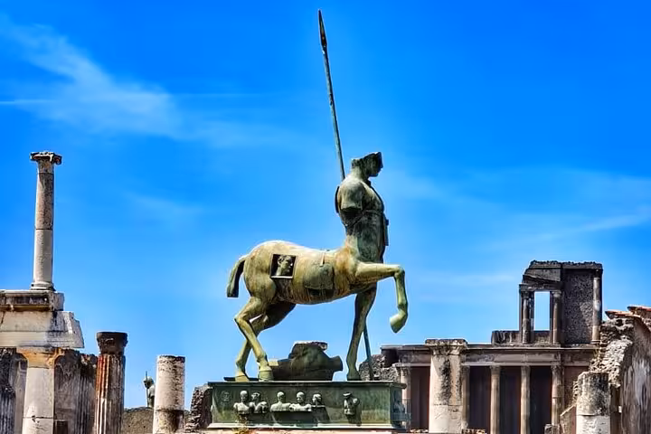 Marvel at Pompeii's iconic centaur statue on a skip-the-line tour, showcasing the city's rich archaeological heritage.
