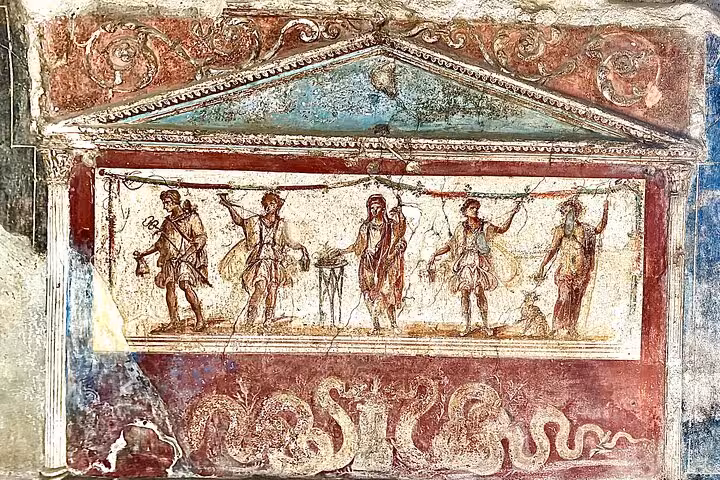 Colorful fresco depicting Roman figures in Pompeii, explore on a guided tour from Positano with skip-the-line convenience.