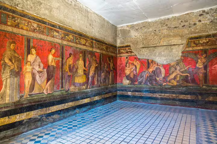 Colorful frescoes in the Villa of the Mysteries showcased on a private guided Pompeii tour with archaeology expert