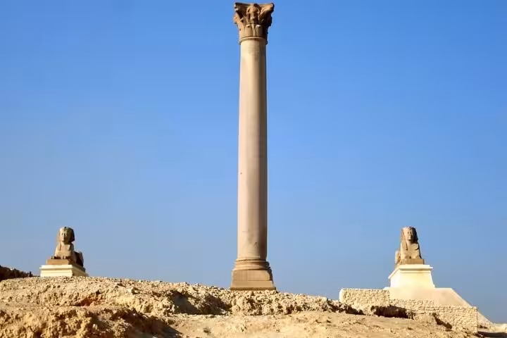 Pompeys Pillar and sphinx statues in Alexandria on a private tour from Cairo with entrance tickets and guide