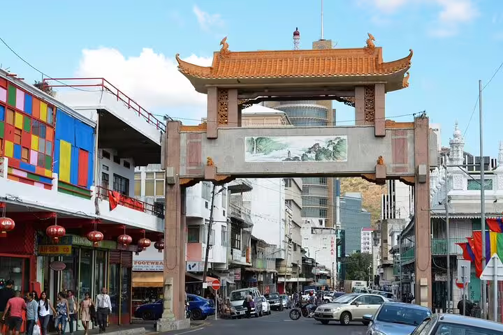 Port Louis Chinatown gateway and lively street scene, included in a private tailored North Mauritius day tour