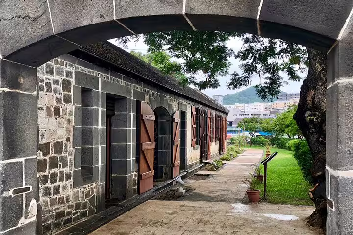 Stone archway and historic fort corridor in Port Louis, a stop on a private North Mauritius full-day tour