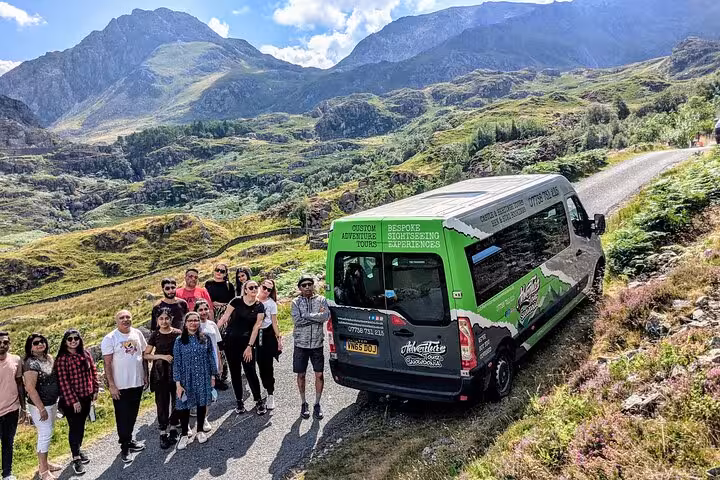 Small group minibus tour stop in Snowdonia, Wales, with scenic mountain valley views on Portmeirion castles trip