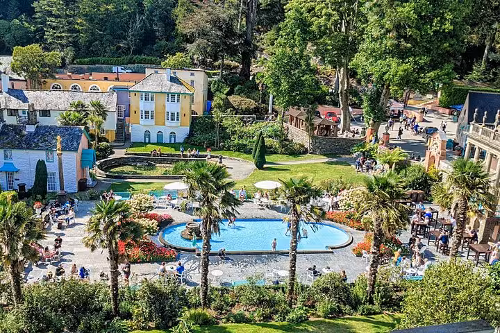 Portmeirion Village gardens with pool and palm trees, scenic stop on Portmeirion Castles and Snowdonia tour
