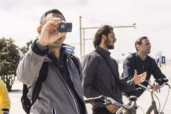 Participants capture memories on a small-group Porto bike tour, enjoying city sights and attractions.