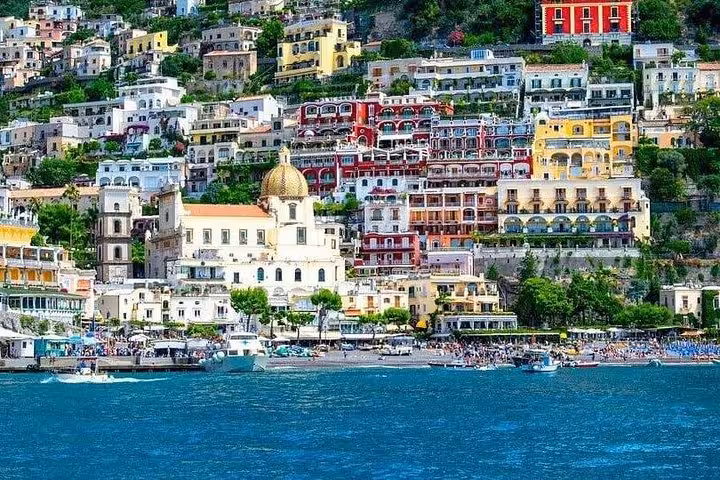 Colorful cliffside buildings in Positano seen from the sea during a scenic Amalfi Coast boat tour.