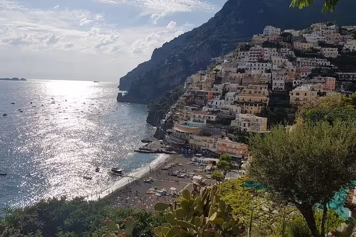 Positano cliffside and beach view on a Rome to Amalfi Coast day tour to Ravello, Amalfi and Positano