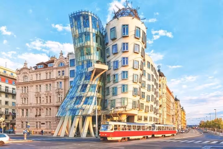 Prague Dancing House with tram passing, scenic photo on Vienna to Prague private transfer with Cesky Krumlov stop