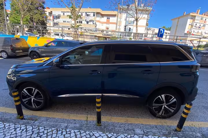 Modern black SUV parked in city street, premium transportation service with private chauffeur and airport transfer