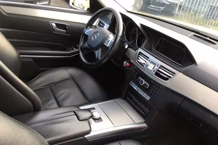 Premium limousine interior with leather seats and modern console for Athens city to Acropolis private transfer