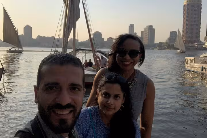 Guests smiling on a Nile boat in Cairo for a private birthday celebration cruise with lunch or dinner and skyline views