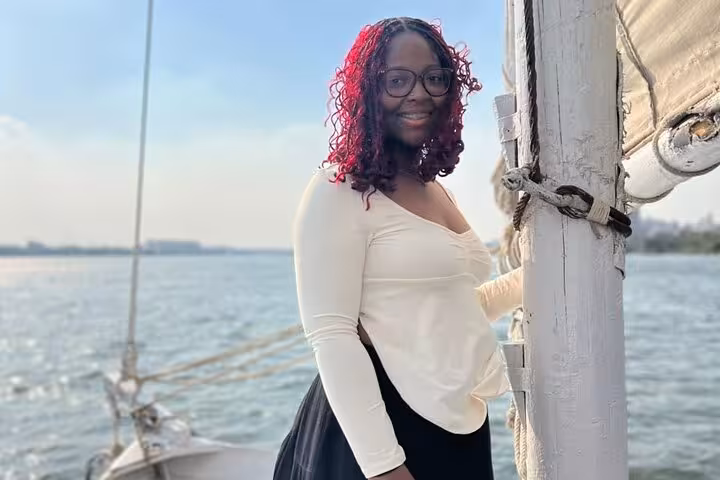 Guest posing on a Nile boat deck in Cairo during a private birthday celebration cruise with lunch or dinner