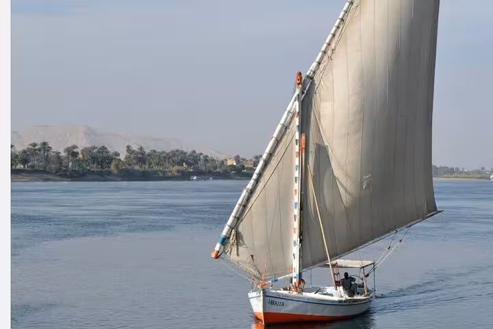 Traditional felucca sailing on the Nile in Cairo, ideal for a private birthday celebration cruise with meal