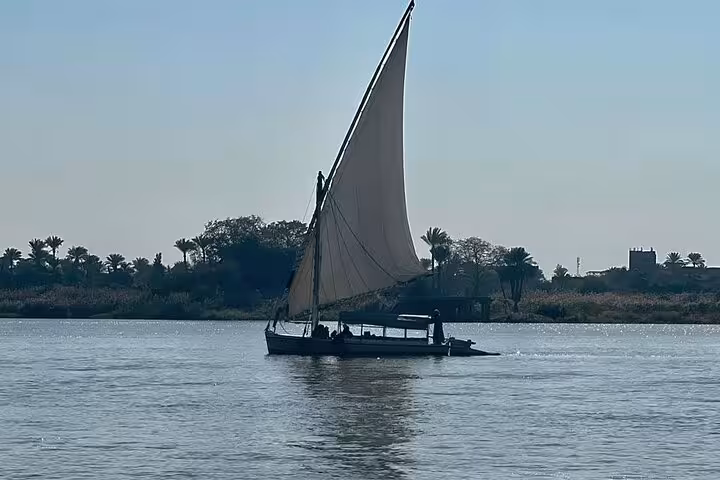 Traditional felucca on the Nile River, ideal for a private birthday celebration boat tour with meal in Cairo