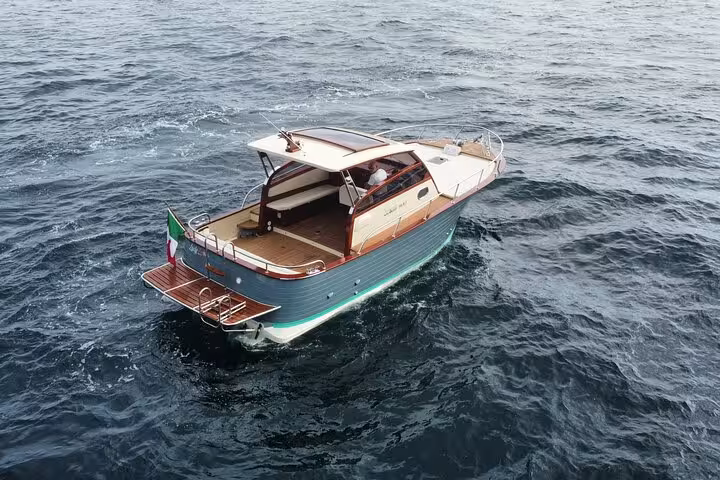 Elegant private boat navigating the serene waters of Capri, perfect for an exclusive 8-hour island tour.