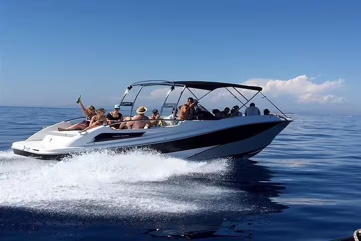 Guests relaxing and enjoying a sunny day on a speedboat during a private tour in Santos.