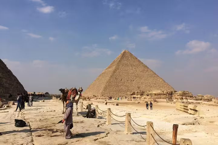 Camel and guide near the Great Pyramid of Giza, Egypt, on a private 2-hour camel or horse ride tour