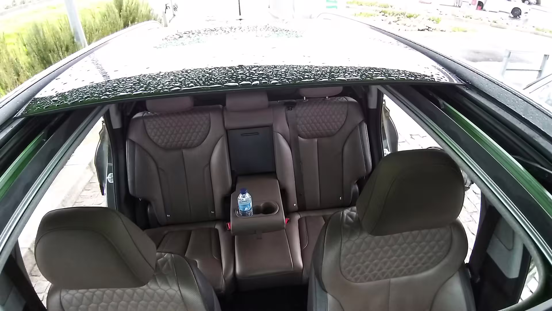 Luxurious leather interior of private transfer car from Porto to Castelo Branco, featuring spacious seating and amenities.