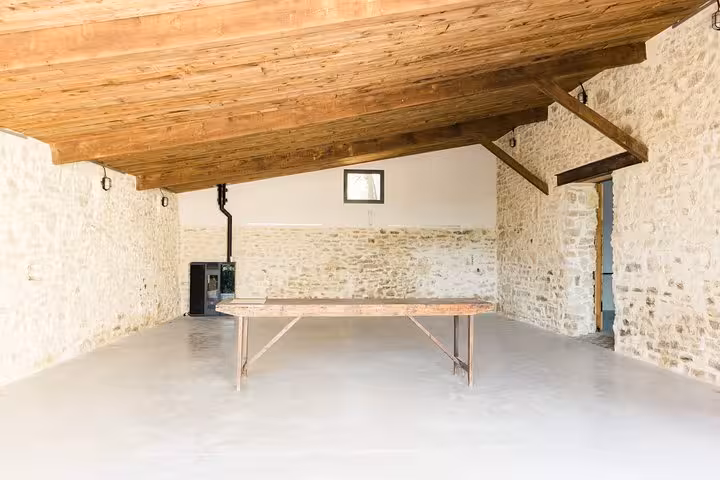 Rustic stone barn dining space for a private chef dinner near lavender fields, Provence countryside ambiance