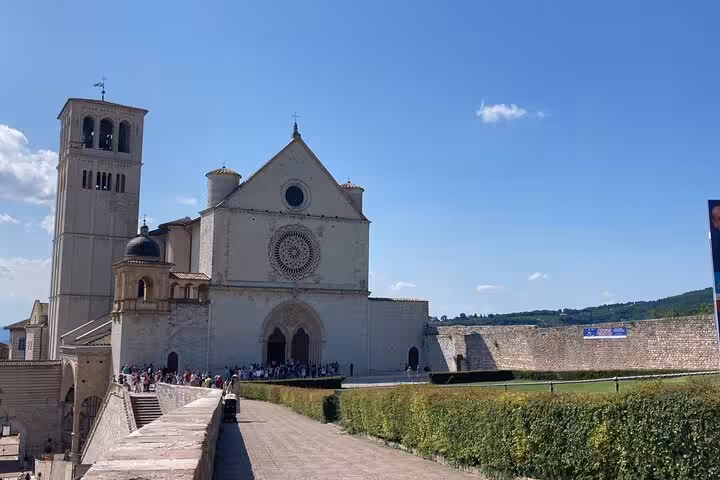 Explore the historic Basilica of Saint Francis on a private day tour from Rome to Assisi, featuring stunning medieval architecture.