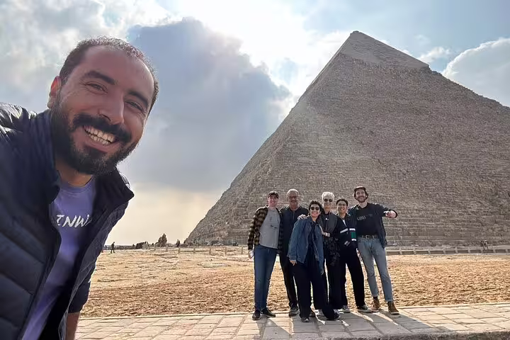 Private Giza Pyramids tour group photo at Great Pyramid of Khufu, Cairo day trip with local guide