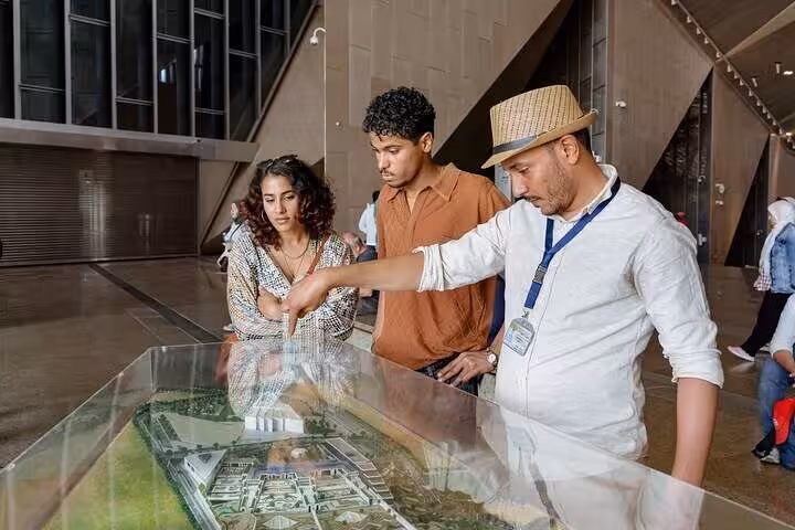 Private guide explains Grand Egyptian Museum model on Cairo tour combining Citadel visit, Khan El Khalili and lunch