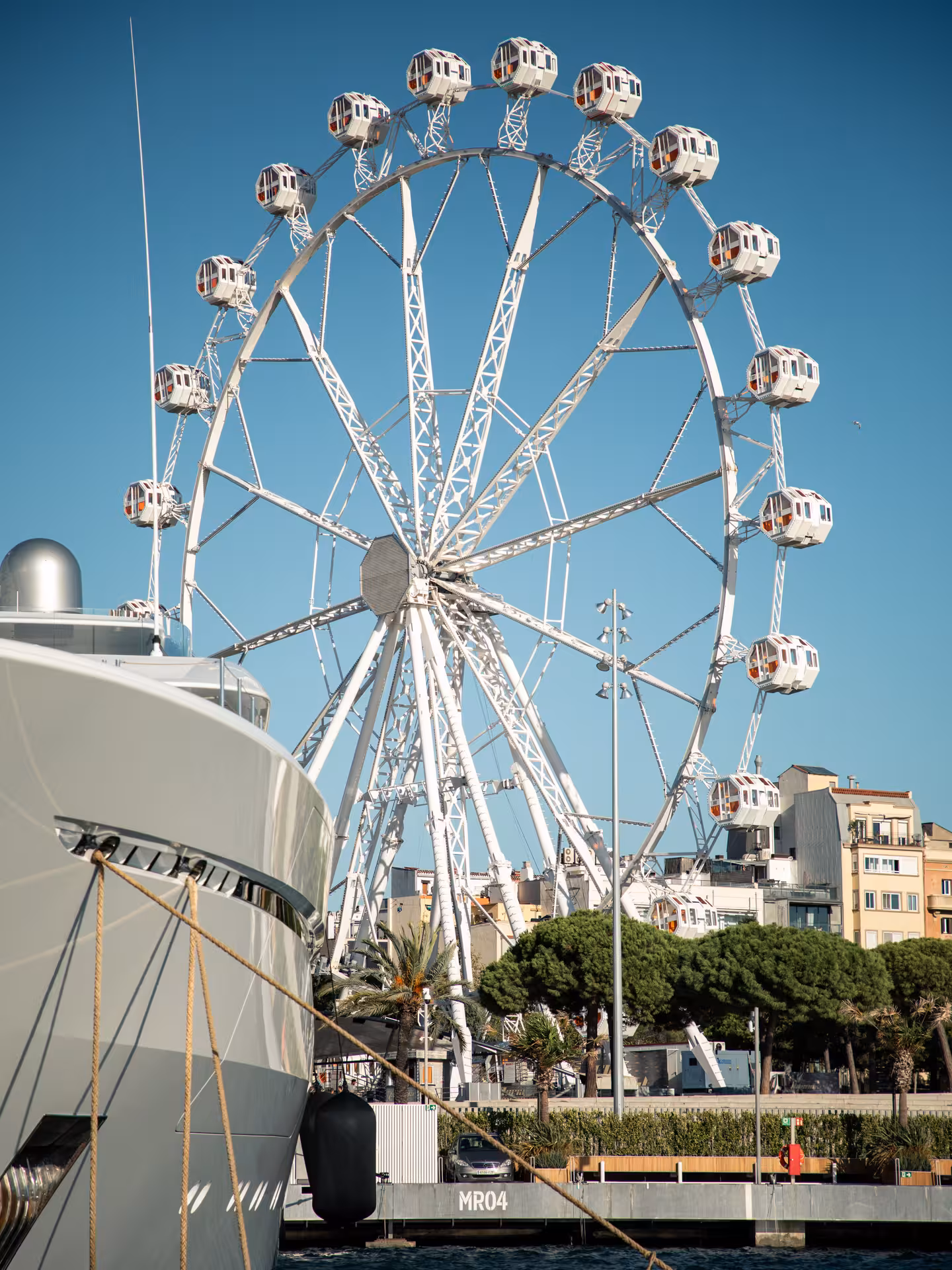 Barcelona Port Vell ferris wheel view from a private luxury catamaran cruise, Bali 4.2, 4-hour charter
