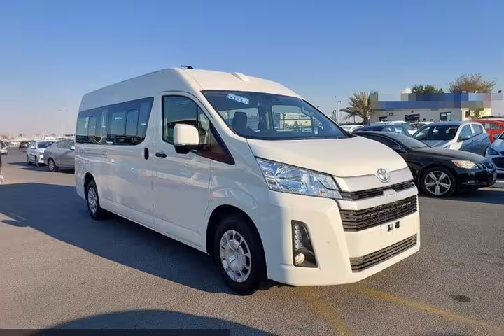 White air-conditioned minibus for one-way private transfer from Hurghada hotels to Cairo hotels, spacious seats