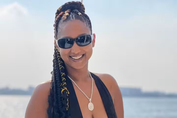 Smiling guest on a private Cairo Nile boat birthday celebration, ideal for lunch or dinner cruise with river views