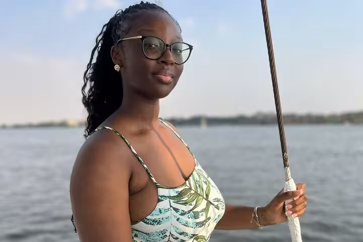 Guest on a private Nile boat birthday cruise in Cairo, enjoying scenic river views before lunch or dinner