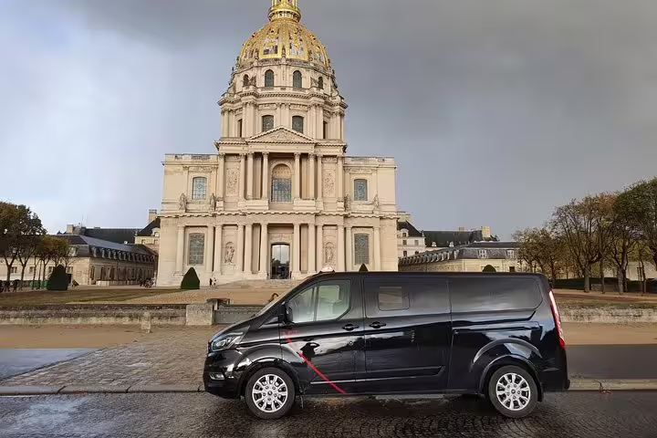 Private sightseeing van parked by Les Invalides dome in Paris, ideal for a half-day tour with driver