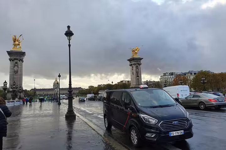 Private driver van on Pont Alexandre III, Paris half-day sightseeing tour with hotel pickup and drop-off