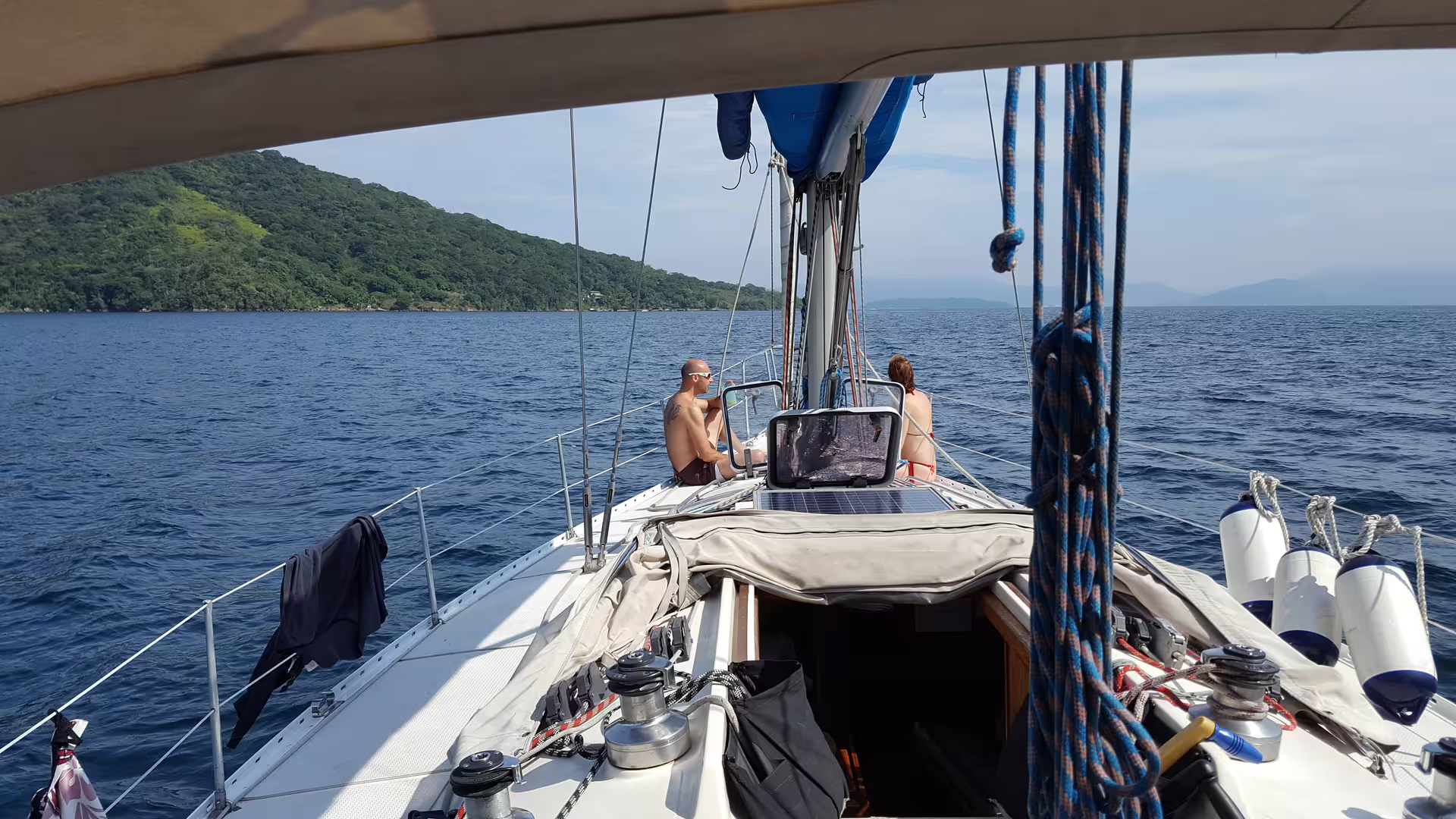 Enjoy a serene private sailing tour on Makani Maikai with stunning coastal views and relaxing deck seating.