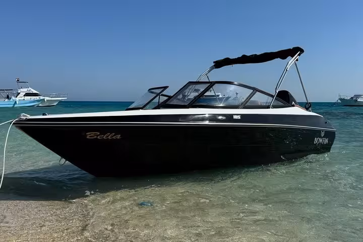 Private speedboat on Magawish Island shore, Hurghada, for Red Sea snorkeling and island escape tour