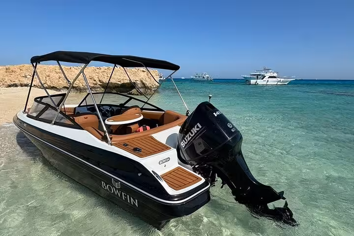 Private speedboat on Mahmya Island shore, Hurghada, crystal Red Sea water, lunch cruise day trip