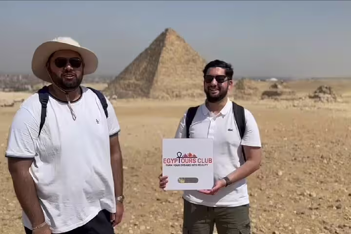 Guests with local guide at Giza Pyramids desert viewpoint, private day tour to the Pyramids and Grand Egyptian Museum
