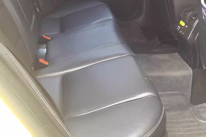 Spacious leather rear seats in private transfer vehicle from Igoumenitsa to Athens for comfortable travel